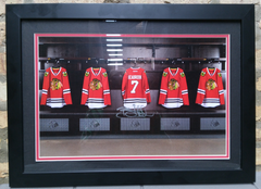 This framed photograph was a gift to 2012 Chicago Blackhawks season ticketholders.  The work is autographed by Hawks' defenseman Brent Seabrook, and includes a certificate of authenticity.  Dimensions:  15.5" x 22" framed.