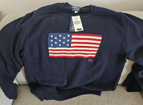 Part of the Polo Ralph Lauren Team USA Collection, this archival-inspired sweater is intarsia-knit with a historical American flag and the Olympic Rings at the front.  It is developed with the legendary designer's iconic Big Fit from the ’90s and features our founder’s initials hand-embroidered at the hem.  Orders for this product will ship 9/14/24.  Expedited orders can be shipped as soon as possible, for an additional $100.