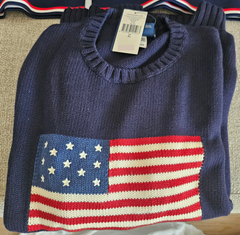 Part of the Polo Ralph Lauren Team USA Collection, this archival-inspired sweater is intarsia-knit with a historical American flag and the Olympic Rings at the front.  It is developed with the legendary designer's iconic Big Fit from the ’90s and features our founder’s initials hand-embroidered at the hem.  Orders for this product will ship 9/14/24.  Expedited orders can be shipped as soon as possible, for an additional $100.